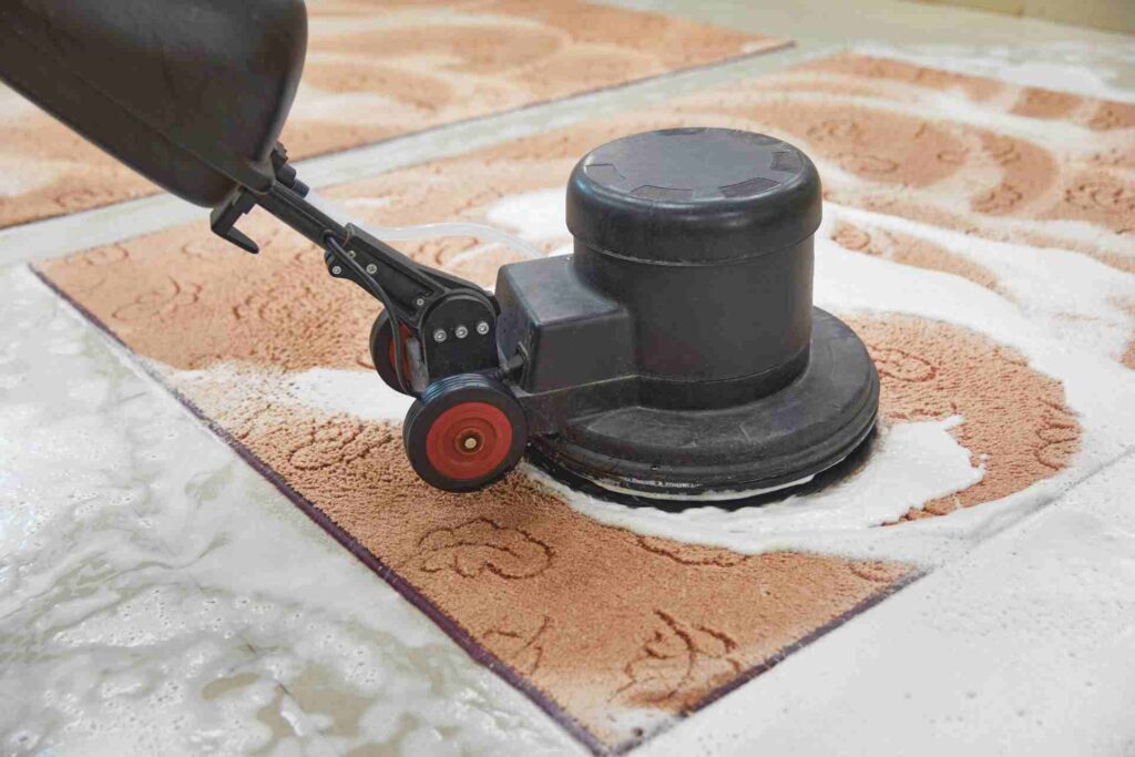 Individual operating a vacuum cleaner on a carpet, showcasing the process of carpet shampooing and upkeep.