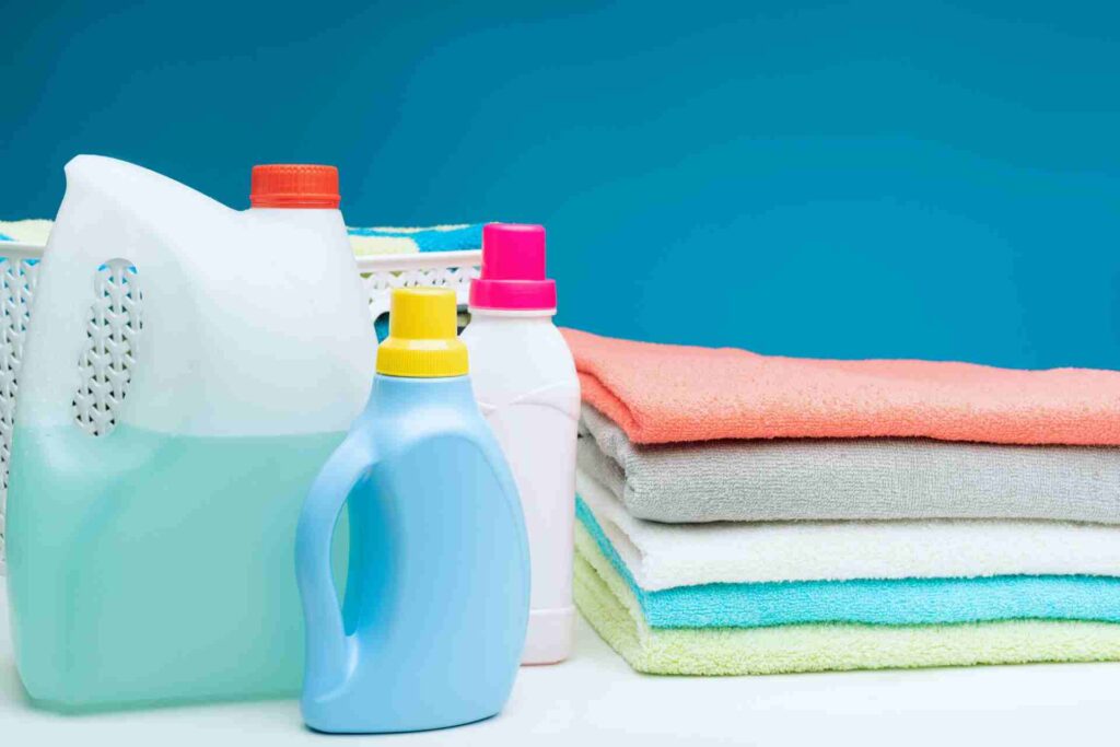 A selection of cleaning products displayed on a white surface, showcasing various bottles and containers.